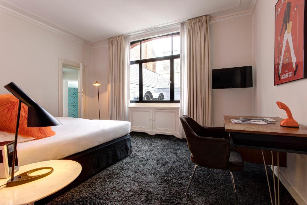 TV a/nebo společenská místnost v ubytování Vintage Hotel Brussels