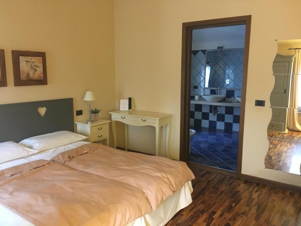 Postel nebo postele na pokoji v ubytování Agriturismo Corte Rocca