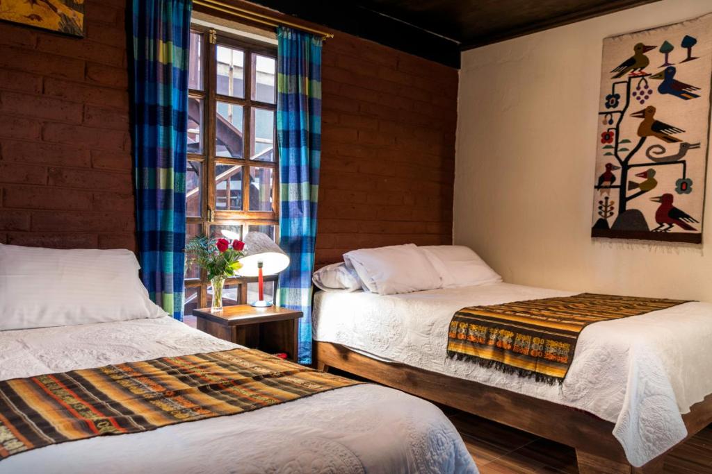 Postel nebo postele na pokoji v ubytování Casa del Arupo