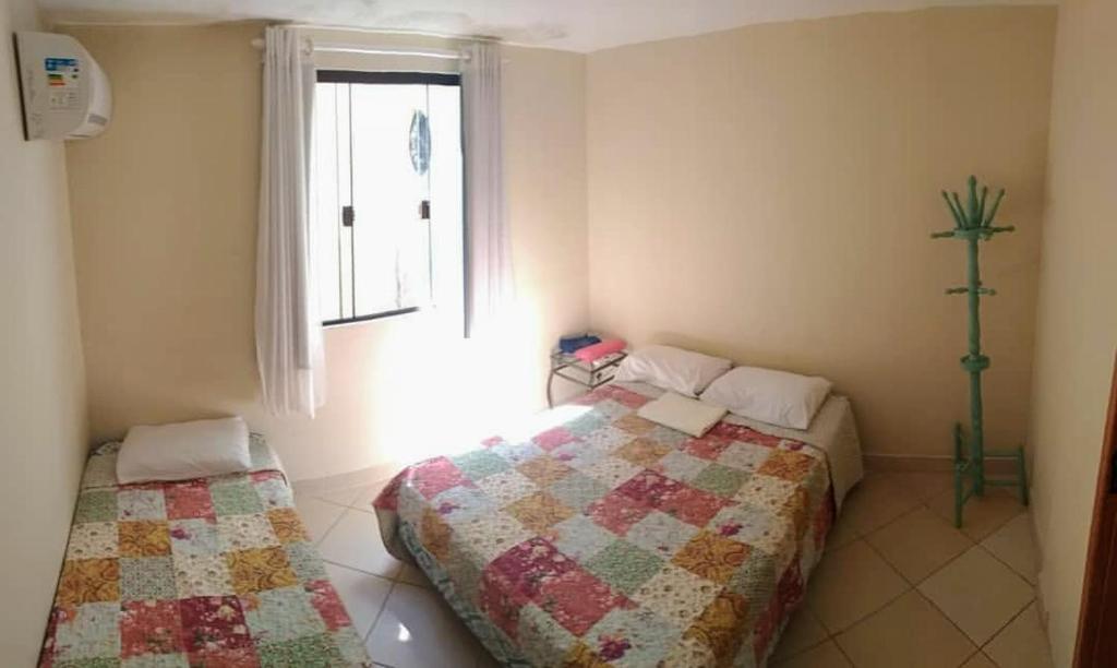 Cama ou camas em um quarto em Le Monde Hostel - Suites e Camas