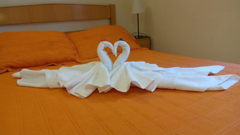 Postel nebo postele na pokoji v ubytování Hostal Huespedes Toledo