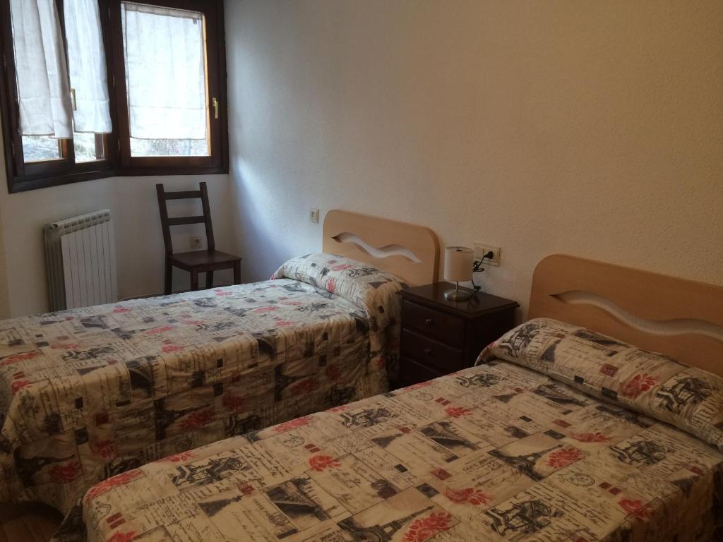 Ein Bett oder Betten in einem Zimmer der Unterkunft Apartamento Santa Marina