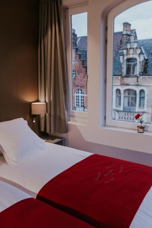 Postel nebo postele na pokoji v ubytování Hotel New Regina