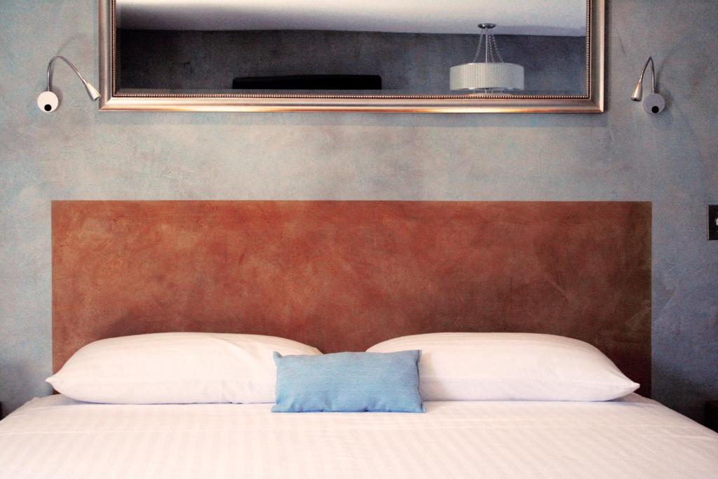 Postel nebo postele na pokoji v ubytování Hotel Rio Malecon