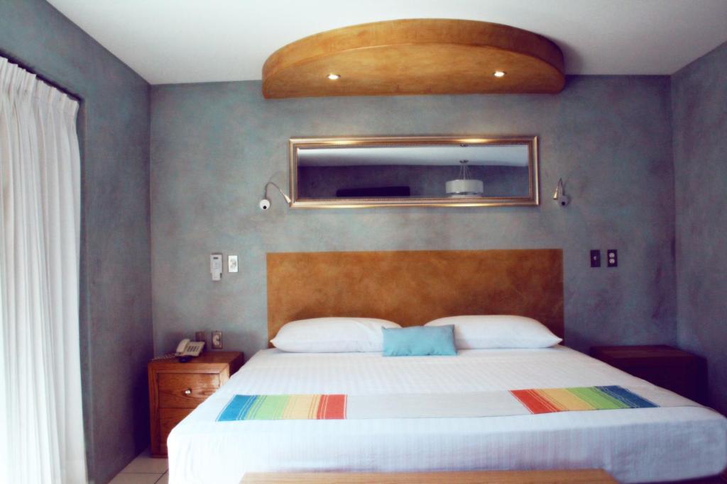 Postel nebo postele na pokoji v ubytování Hotel Rio Malecon