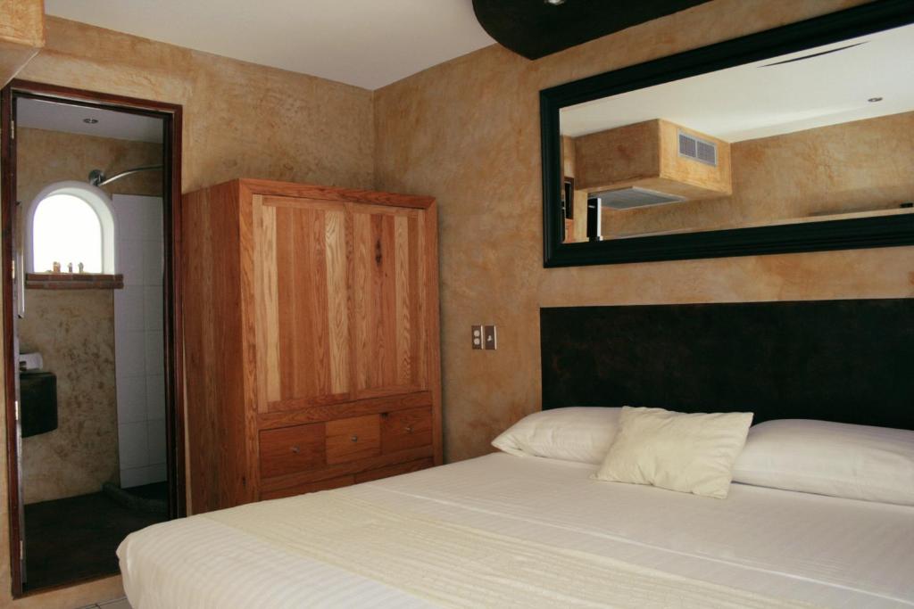Postel nebo postele na pokoji v ubytování Hotel Rio Malecon