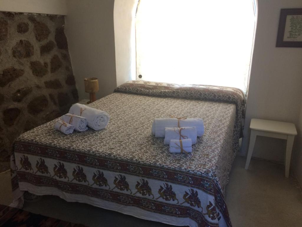 Postel nebo postele na pokoji v ubytování Dammuso Sant'Anna
