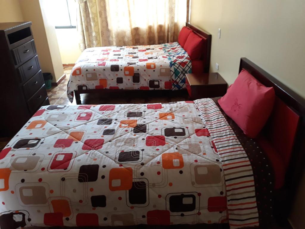 Postel nebo postele na pokoji v ubytování Hotel Navarra