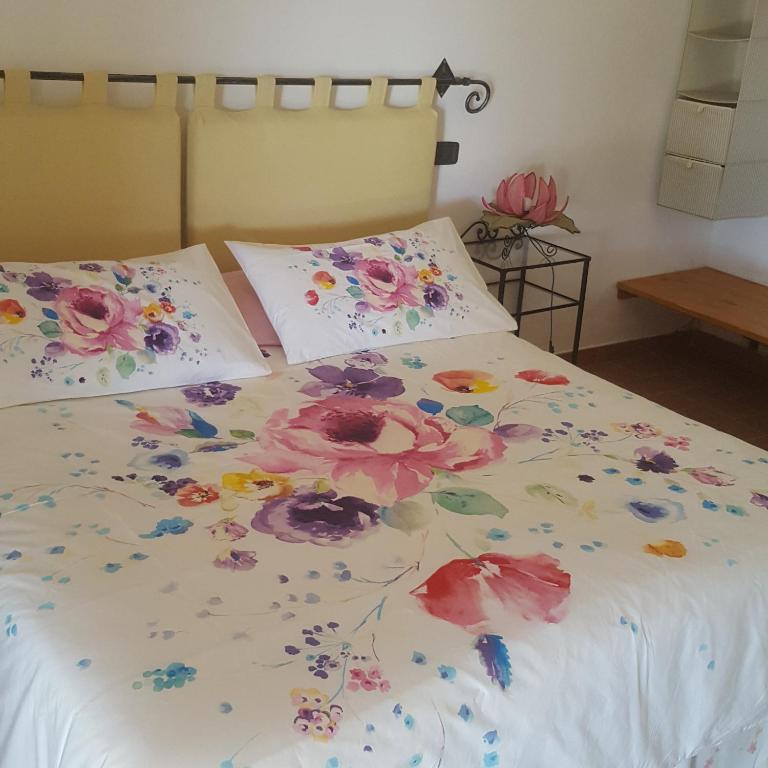 Postel nebo postele na pokoji v ubytování Le Siepi
