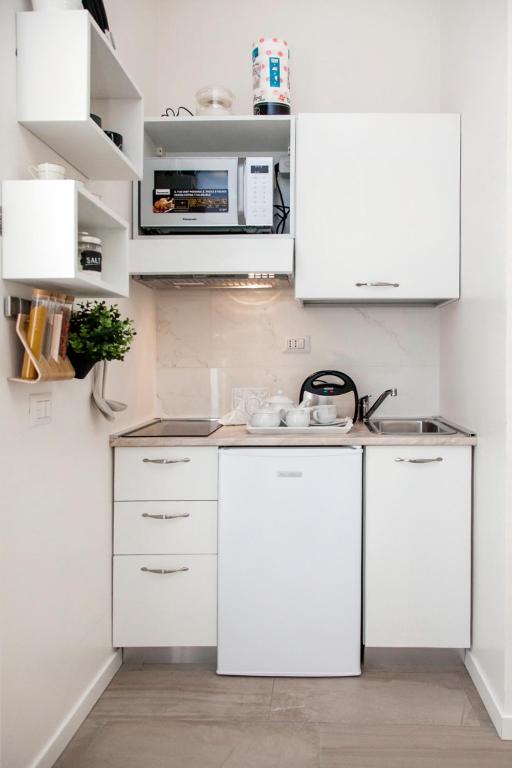 Kuchyň nebo kuchyňský kout v ubytování Cristel Apartment - 15 min da Milano