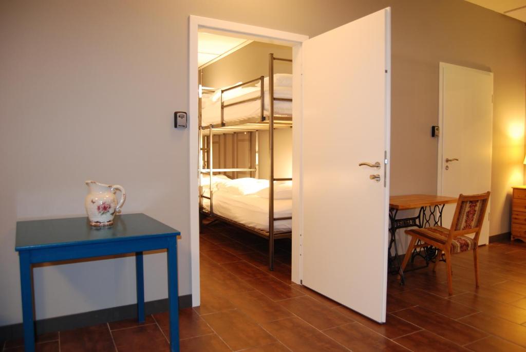 A bed or beds in a room at Tehúsið Hostel & Guesthouse