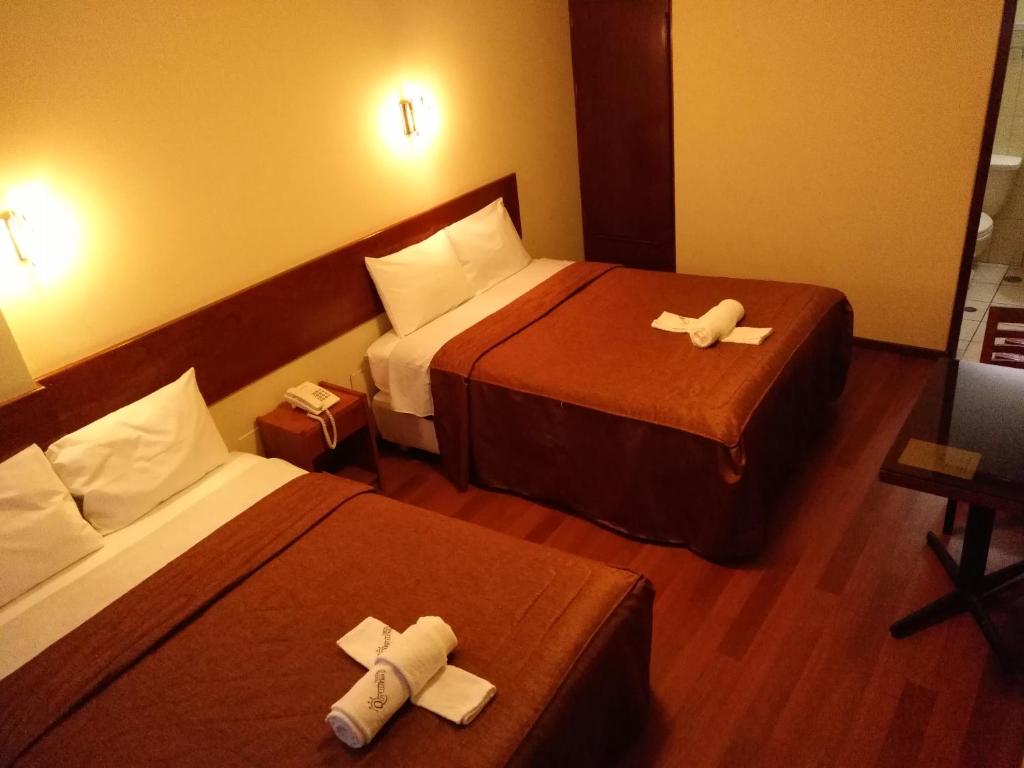 Postel nebo postele na pokoji v ubytování Hostal Qoyllurwasi