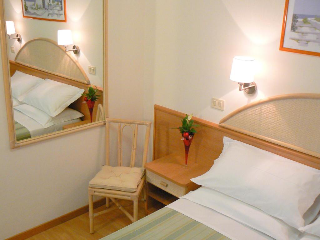 Postel nebo postele na pokoji v ubytování Hotel Rivazzurra
