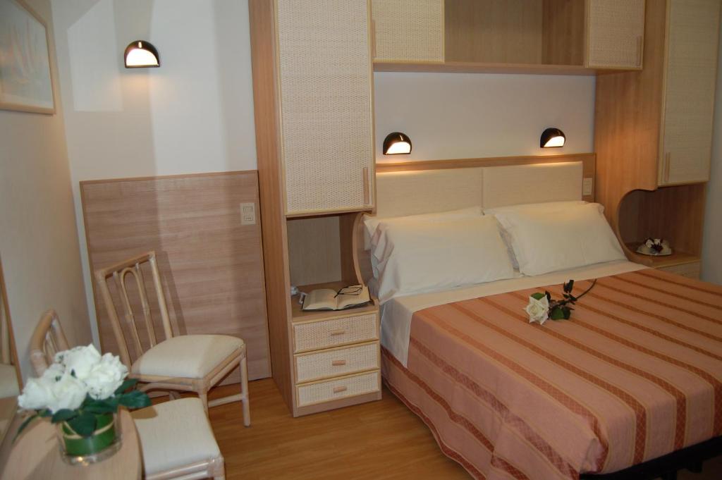Postel nebo postele na pokoji v ubytování Hotel Rivazzurra