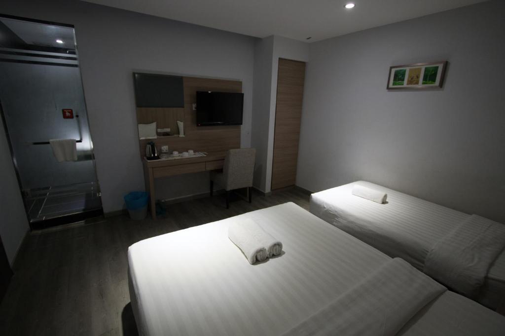 Postelja oz. postelje v sobi nastanitve Hotel 99 Pusat Bandar Puchong