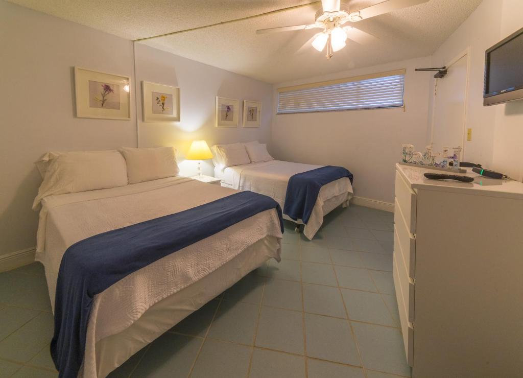 Postel nebo postele na pokoji v ubytování Kawama Yacht Club Apartment