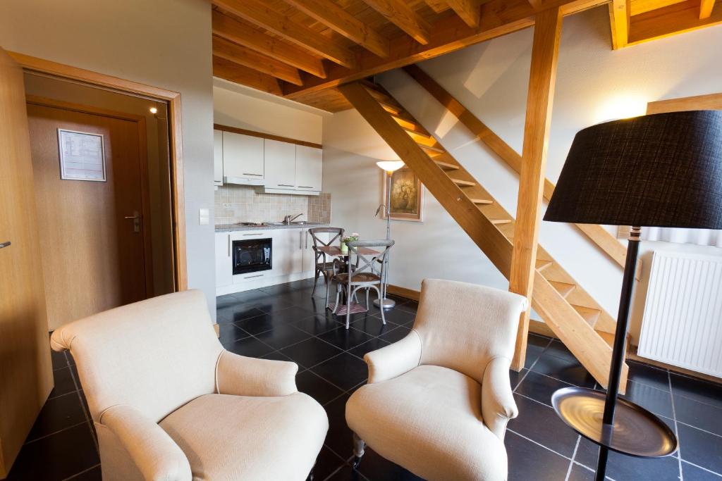 Kuchyň nebo kuchyňský kout v ubytování Aparthotel Le Manoir du Capitaine