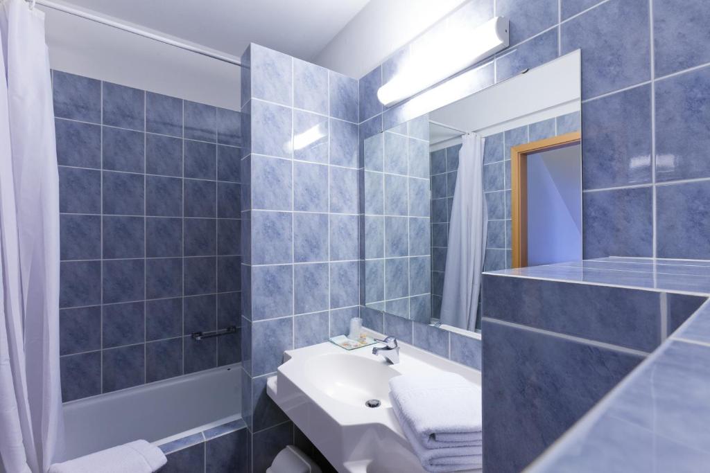 Koupelna v ubytování Aparthotel Le Manoir du Capitaine