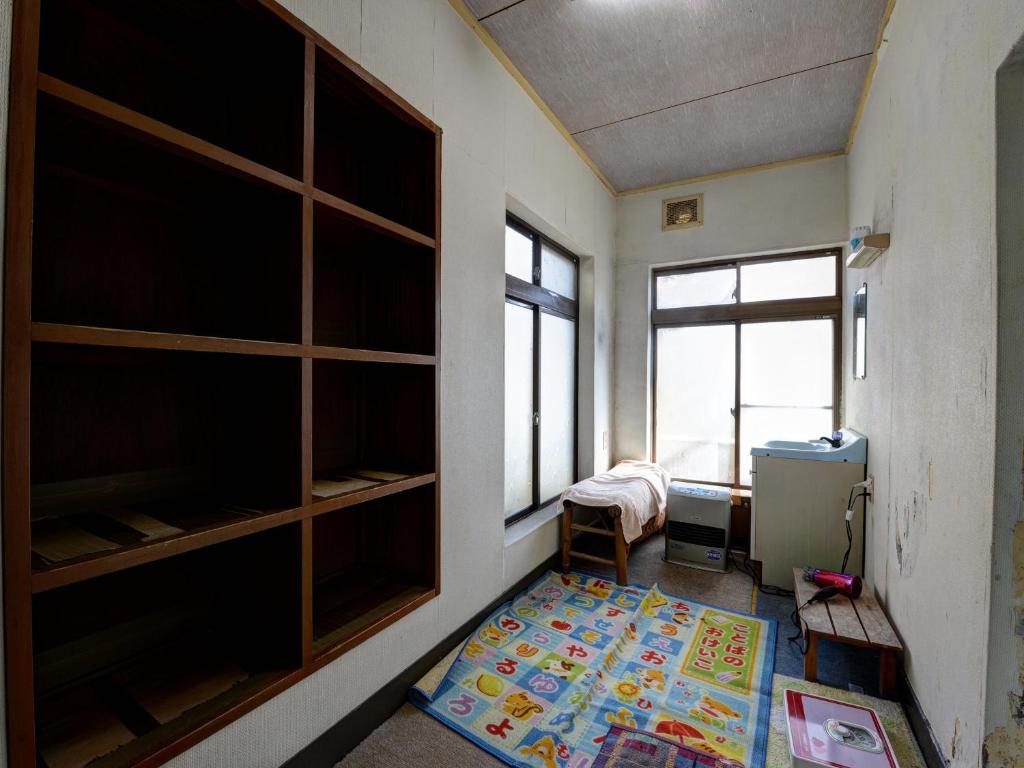Postel nebo postele na pokoji v ubytování Masuya Ryokan