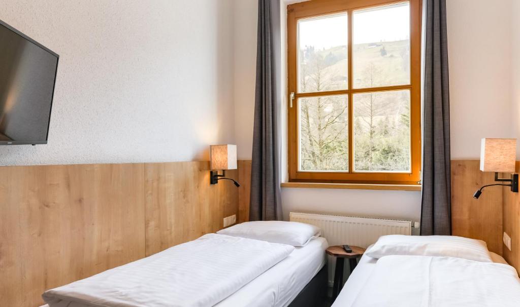 Postel nebo postele na pokoji v ubytování Kitz Residenz by Alpin Rentals - incl Summercard