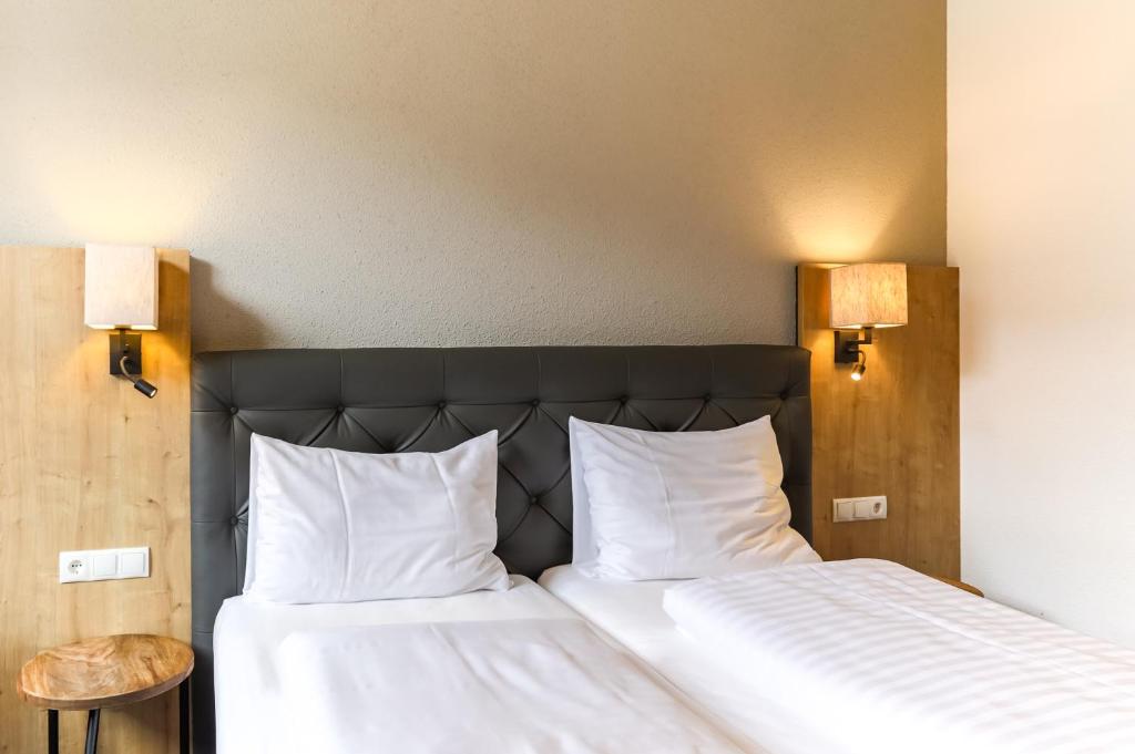 Postel nebo postele na pokoji v ubytování Kitz Residenz by Alpin Rentals - incl Summercard