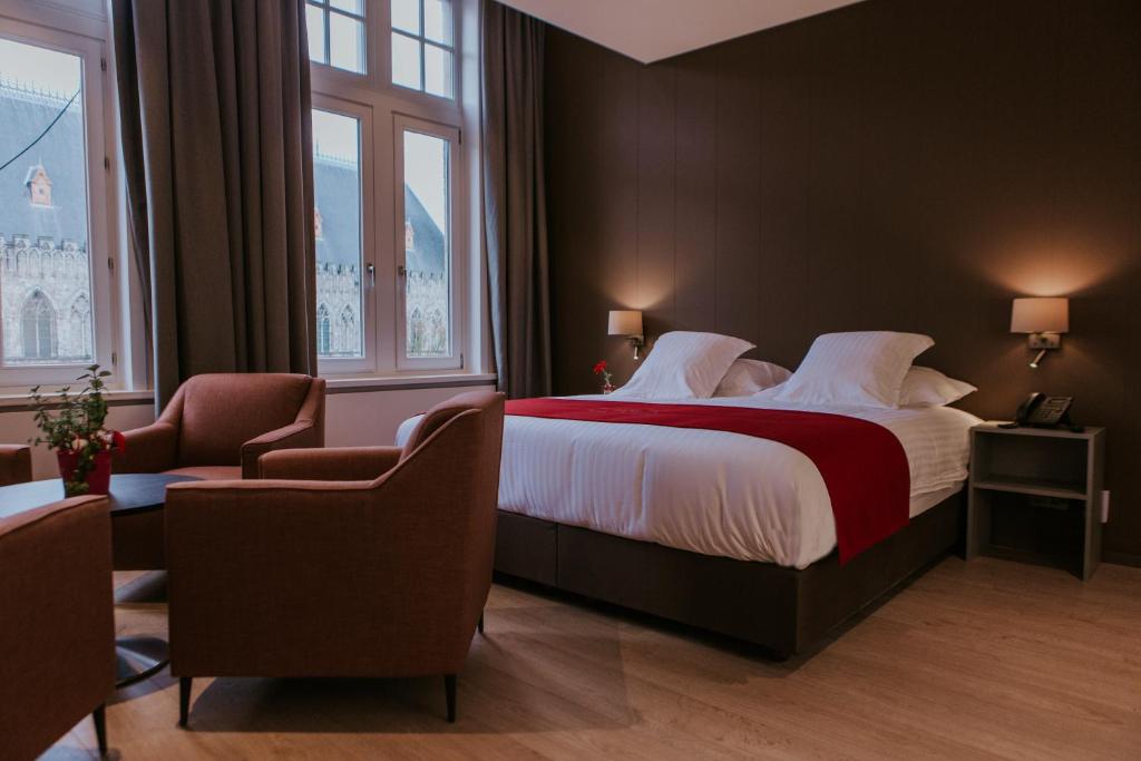 Postel nebo postele na pokoji v ubytování Hotel New Regina