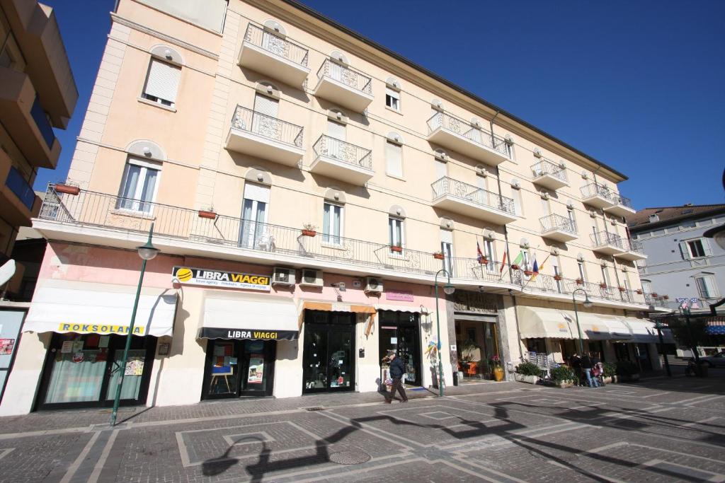 a large building on the corner of a street at Hotel Stella D'Italia - Nuova gestione in Rimini