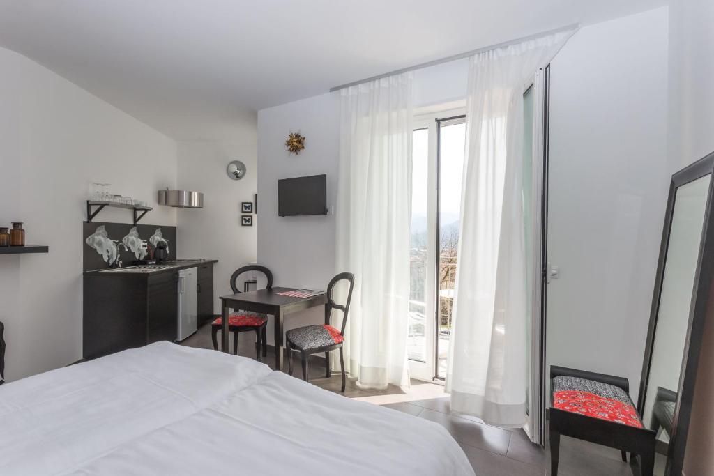 Postel nebo postele na pokoji v ubytování Minerva Residence