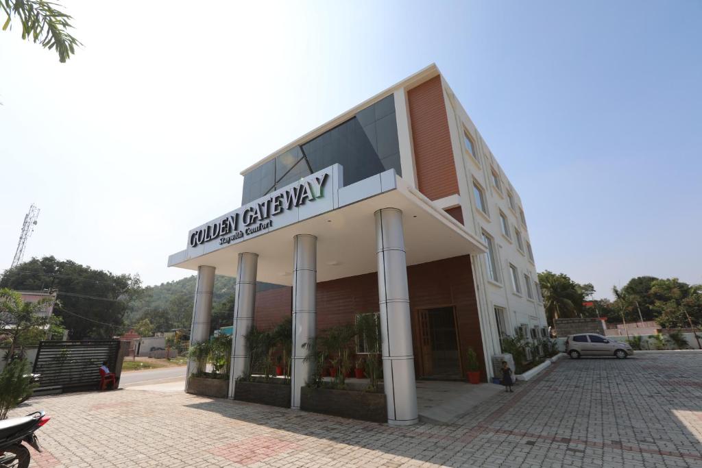 a building with a sign that reads global epilepsy at Hotel Golden Gateway in Vellore