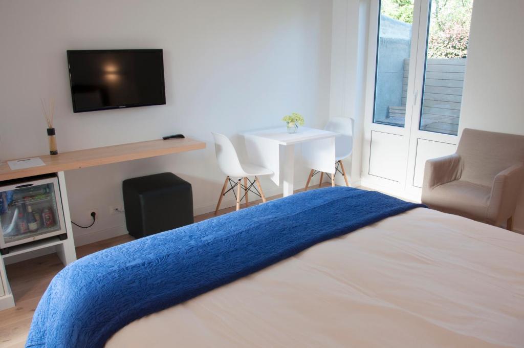 TV a/nebo společenská místnost v ubytování B&B Aquavit