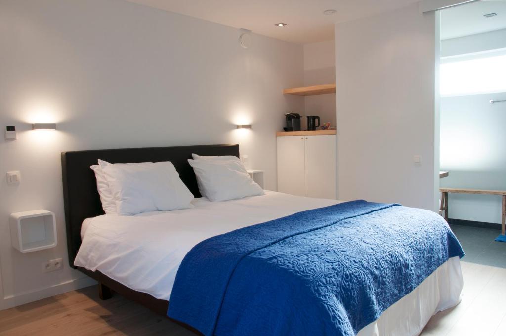 Postel nebo postele na pokoji v ubytování B&B Aquavit