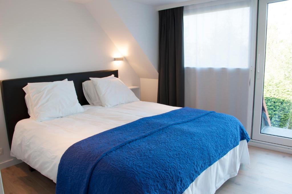 Postel nebo postele na pokoji v ubytování B&B Aquavit