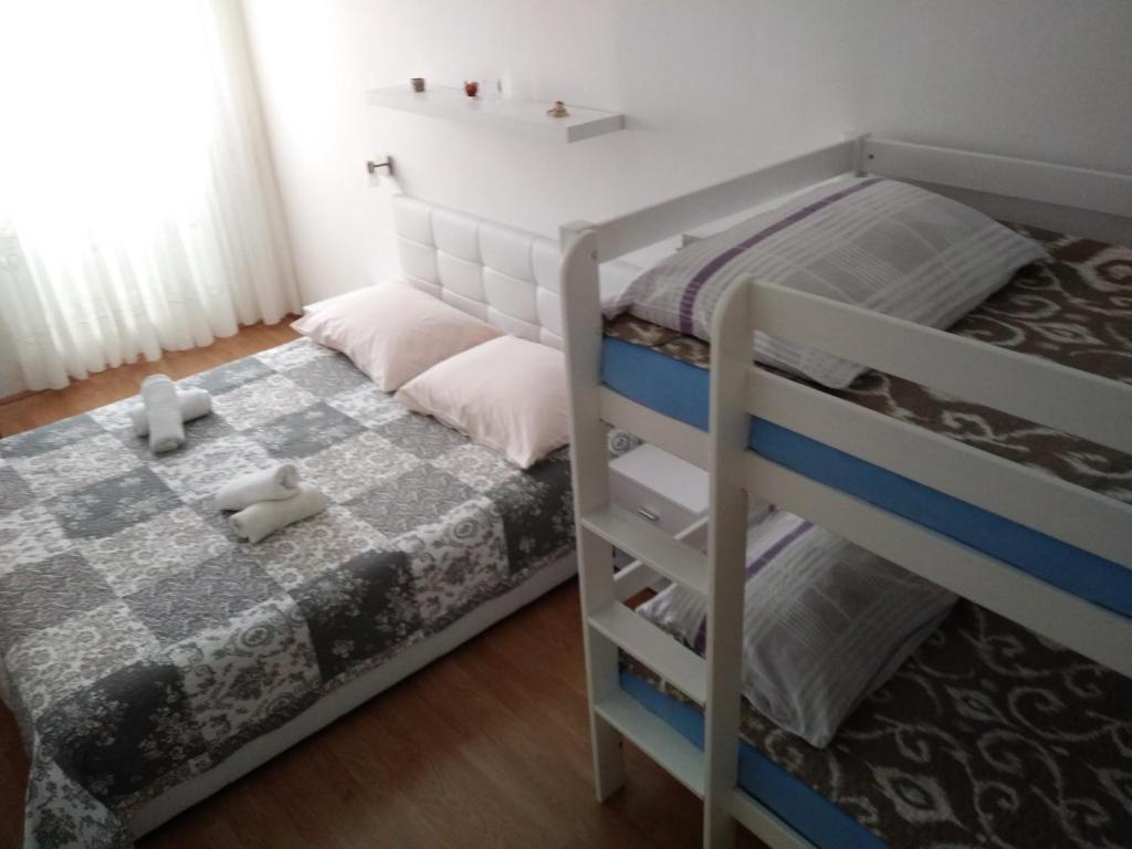 Postel nebo postele na pokoji v ubytování Apartment Doris