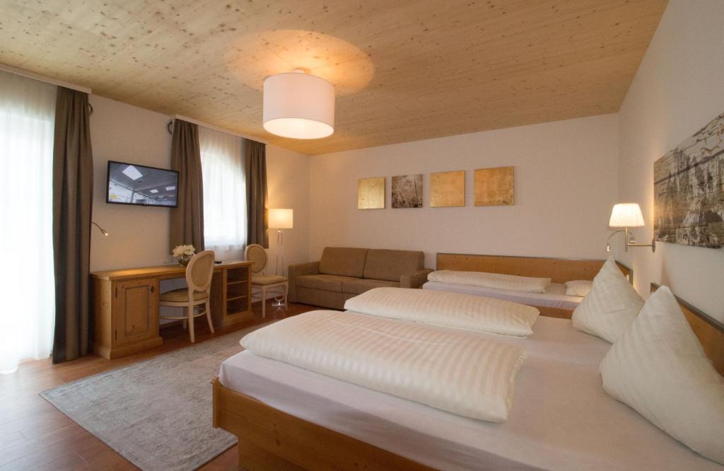 Postel nebo postele na pokoji v ubytování Hotel Munde