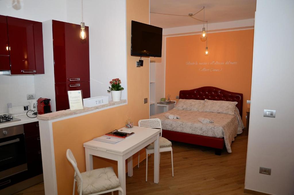 Postel nebo postele na pokoji v ubytování L'Orizzonte Relais Sirolo
