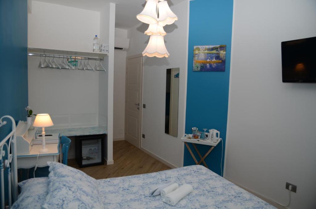 Postel nebo postele na pokoji v ubytování L'Orizzonte Relais Sirolo