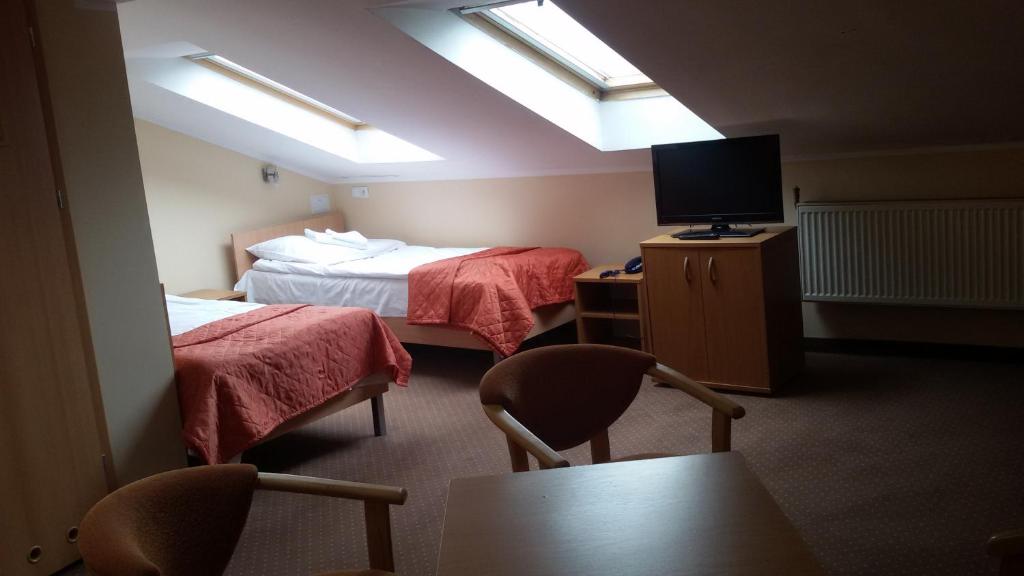 Postel nebo postele na pokoji v ubytování Hotel *** NAT Ustroń