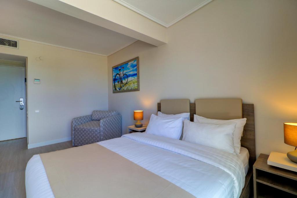 Voodi või voodid majutusasutuse Palace Hotel Glyfada toas