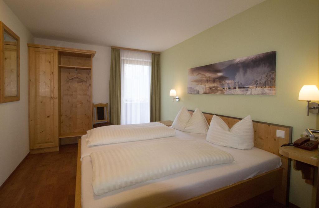 Postel nebo postele na pokoji v ubytování Hotel Munde