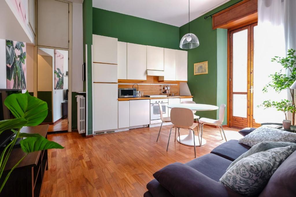 a living room with a couch and a table at The Best Rent - Renovated in March 2024 in Milan