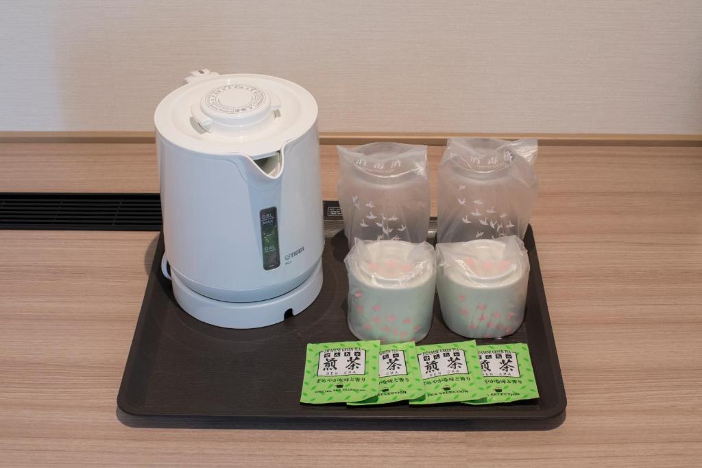 Příslušenství pro přípravu čaje a kávy v ubytování Fujinomiya Fujikyu Hotel
