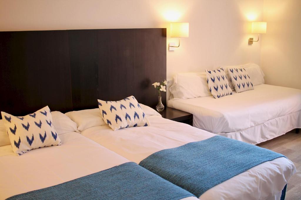 Postel nebo postele na pokoji v ubytování Hostal Jakiton