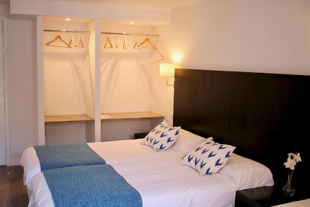 Postel nebo postele na pokoji v ubytování Hostal Jakiton