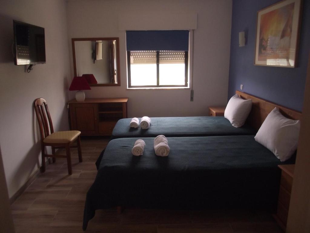 Postel nebo postele na pokoji v ubytování "A Casa dos Avôs" Suites & Breakfast