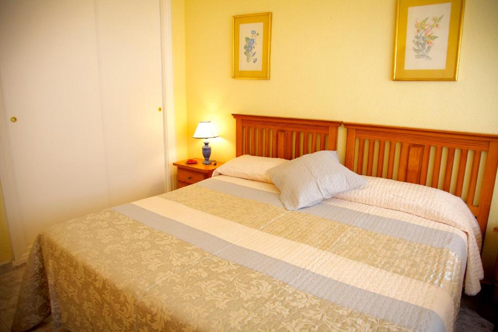 Posteľ alebo postele v izbe v ubytovaní Apartamento Tamarindos II