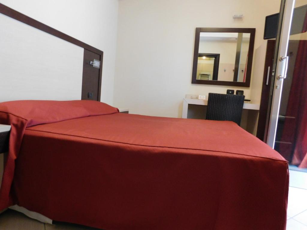 Postel nebo postele na pokoji v ubytování Hotel Risberg