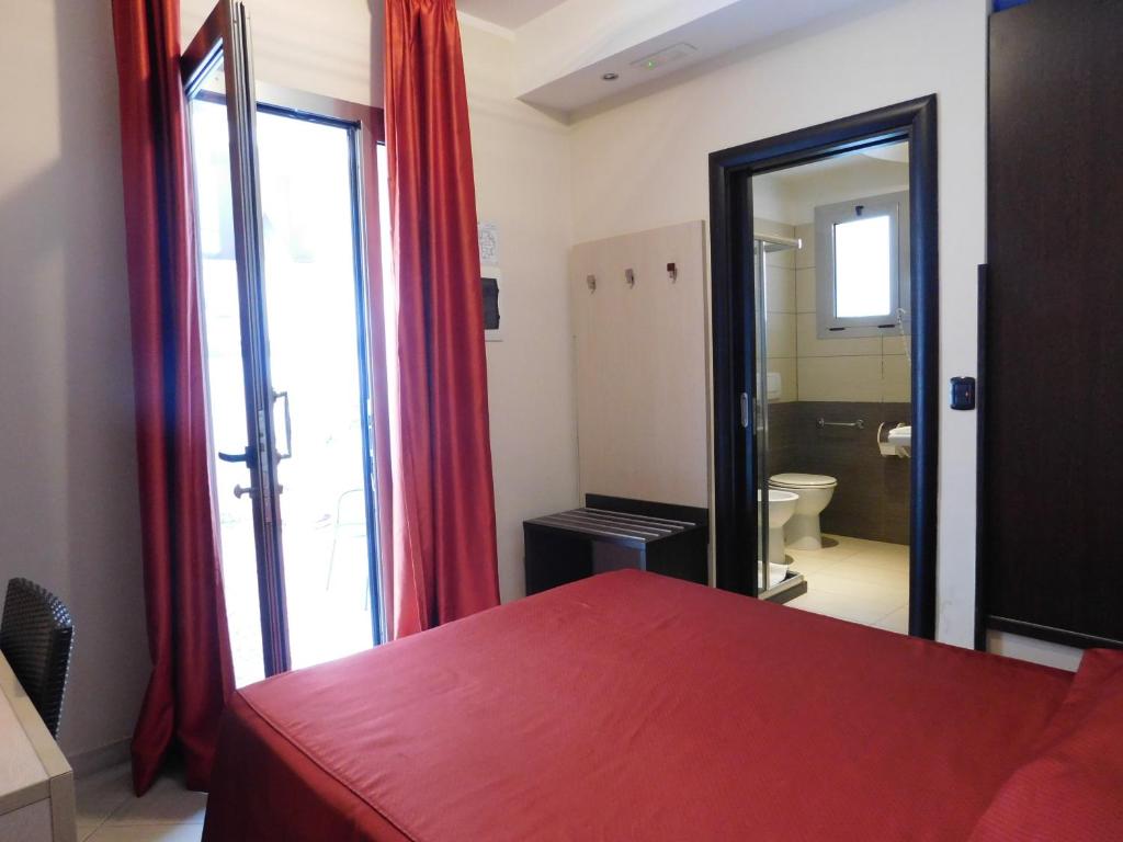 Postel nebo postele na pokoji v ubytování Hotel Risberg