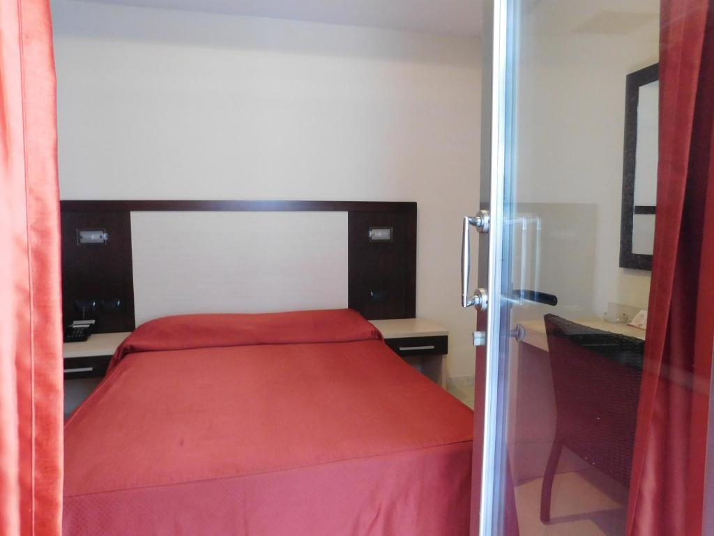 Postel nebo postele na pokoji v ubytování Hotel Risberg