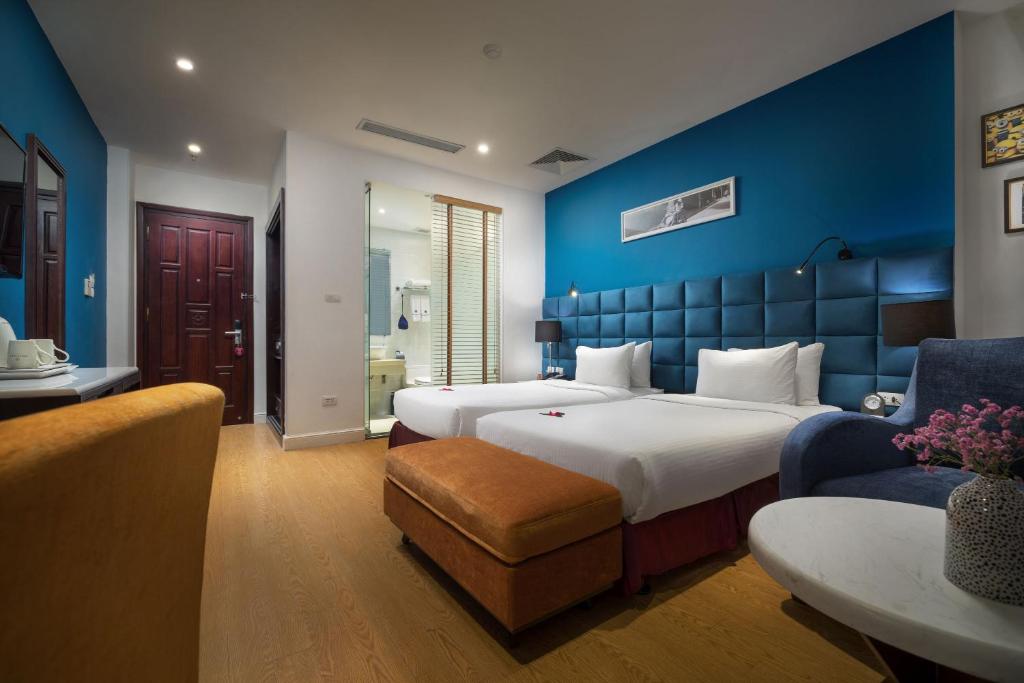 Postel nebo postele na pokoji v ubytování Hanoi Brilliant Hotel & Spa