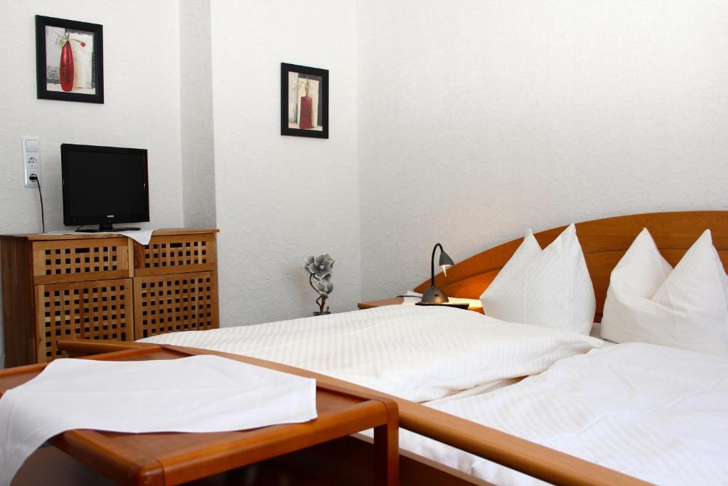 Postel nebo postele na pokoji v ubytování Hotel Cafe Bothe